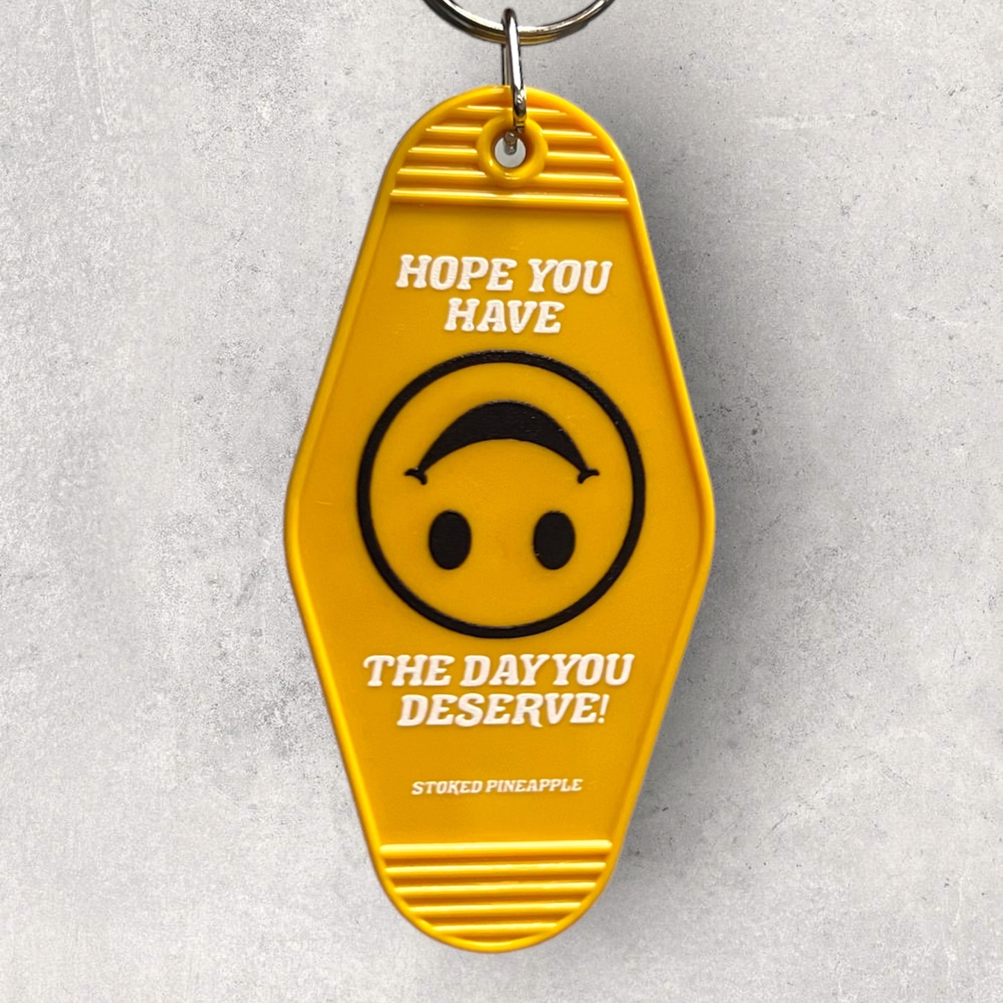 Have The Day You Deserve Motel Keychain
